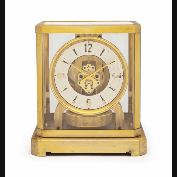 Jaeger-Lecoultre Jaeger-LeCoultre. An Early Gilt Brass and Glass Atmos Clock with Pamphlet SIGNED JAEGER-LECOULTRE, MODEL ATMOS III, MOVEMENT NO. 60'518, MANUFACTURED IN 1954
