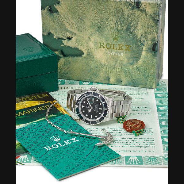 ROLEX. A STAINLESS STEEL AUTOMATIC WRISTWATCH WITH SWEEP CENTRE SECONDS, DATE, BRACELET, ORIGINAL GUARANTEE, ANCHOR AND BOX SIGNED ROLEX, OYSTER PERPETUAL DATE, SUBMARINER, 1000FT=300M, REF. 16610, CASE NO. X903251, CIRCA 1993