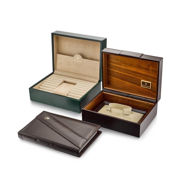 Rolex A set of two leather presentation boxes and notepad, Circa 1985 | 勞力士 | 一套兩件皮製盒子及記事本，約1985年製