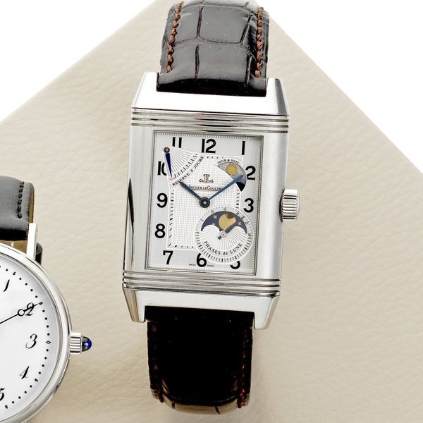 Jaeger-LeCoultre Jaeger-LeCoultre. A stainless steel manual wind reversible wristwatch with day and night indication, moon phases and power reserve Reverso Grande Sun Moon, Ref:240.8.27, Case No.2436248, Movement No.28'800 V/H, Sold 23rd December 2009 · 240.8.27
