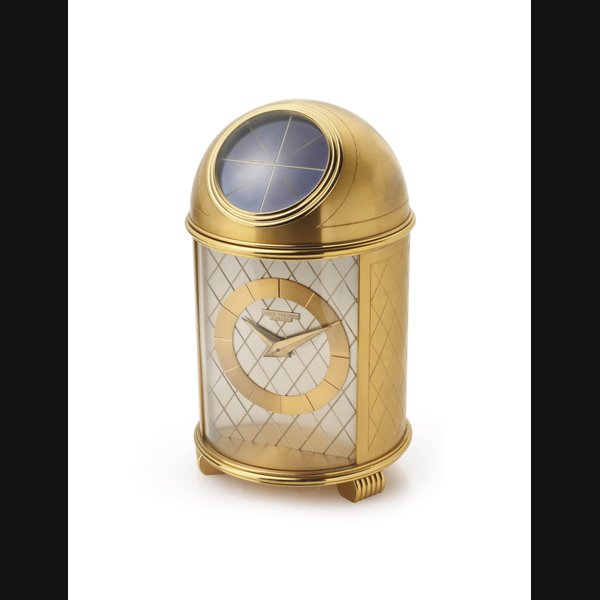 Patek Philippe. A Fine Gilt Brass Solar-Powered Table Clock SIGNED PATEK PHILIPPE, GENÈVE, DOME MODEL, REF. 701, MOVEMENT NO. 872'548, CASE NO. 70101, MANUFACTURED IN 1953