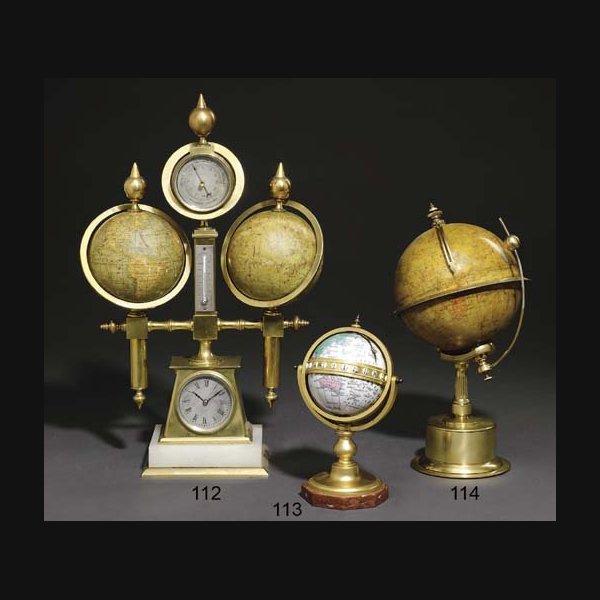 A French brass and onyx eight day compendium timepiece with twin globes, barometer and thermometer CIRCA 1890