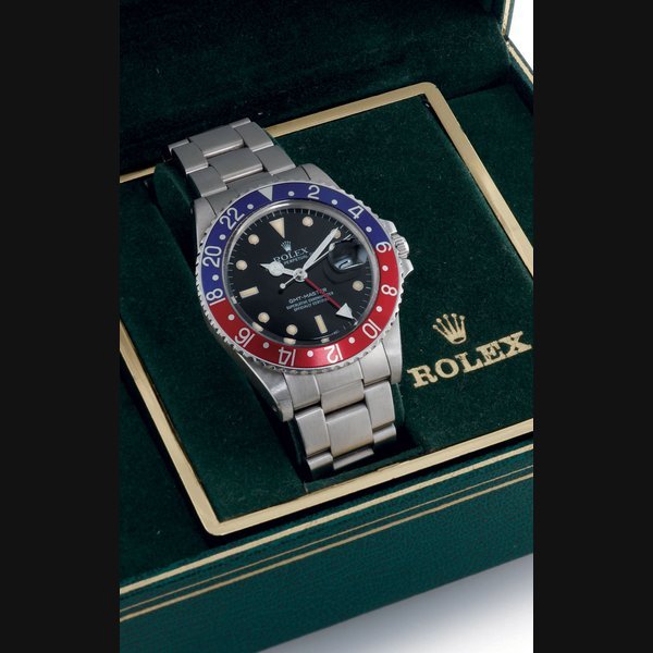 Rolex ROLEX. A STAINLESS STEEL AUTOMATIC WRISTWATCH WITH DATE, CENTER SECONDS, 24 HOURS AND BRACELET SIGNED ROLEX, OYSTER PERPETUAL, GMT-MASTER, CASE NO. 9422299, REF. 16750, CIRCA 1986 · 16750