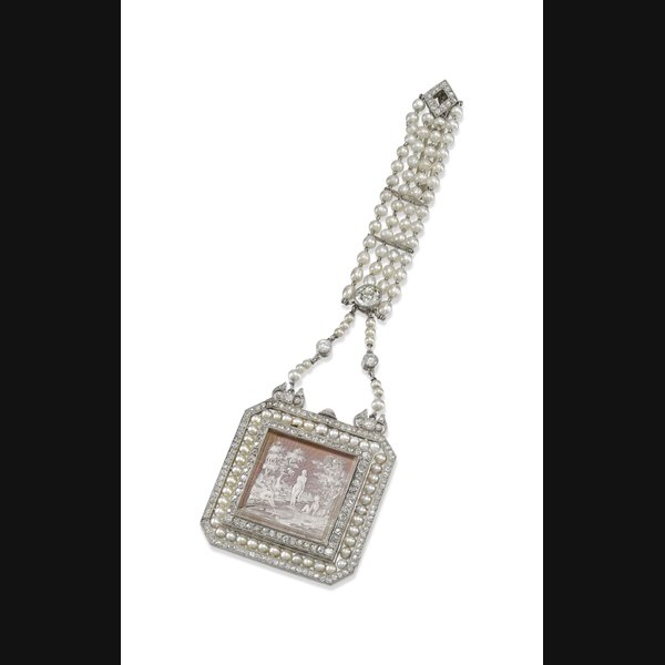 Patek Philippe. An extremely fine and exceptionally rare platinum, reverse intaglio crystal, diamond and pearl-set keyless lapel watch suspended from a diamond and pearl-set brooch Signed Patek, Philippe & Co., Geneva, Switzerland, movement no. 161’852, case no. 272’226, manufactured in 1910