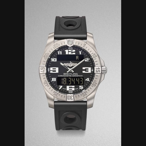 BREITLING. A TITANIUM MULTIFUNCTION PILOT’S MINUTE REPEATING DUAL TIME CHRONOGRAPH WRISTWATCH WITH ANALOG AND DIGITAL DISPLAY, ALARM, COUNTDOWN TIMER, DATE, DAY OF THE WEEK, ORIGINAL GUARANTEE AND BOX SIGNED BREITLING, CHRONOMETRE AEROSPACE EVO, REF. E79363, CASE NO. 1’563’084, CIRCA 2016