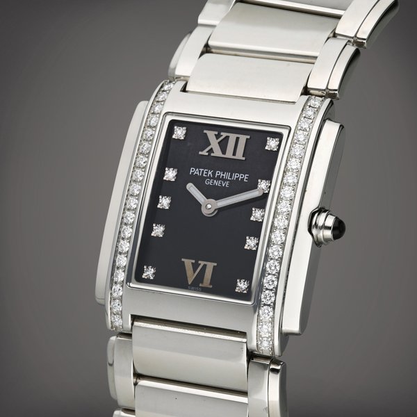 Patek Philippe Reference 4910/10A-001 Twenty-4 | A stainless steel and diamond-set wristwatch with bracelet, Circa 2022