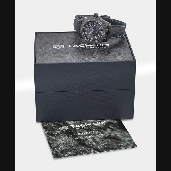 Tag Heuer TAG HEUER. A PVD-COATED TITANIUM AUTOMATIC WRISTWATCH WITH DATE, ORIGINAL WARRANTY AND BOX SIGNED TAG HEUER, AQUARACER, CALIBRE 5, 300M / 1000FT, REF. WBD218C-0, CASE NO. RTE5691, CIRCA 2018, Price & Market Data
