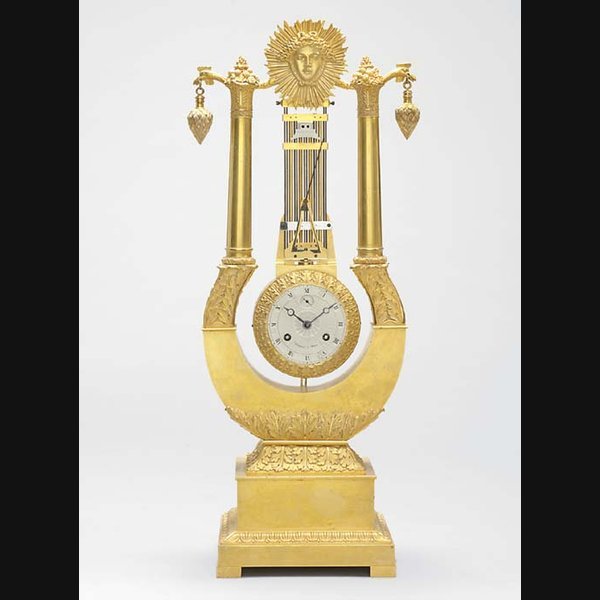 A Charles X ormolu striking lyre clock with integral swinging pendulum CIRCA 1830