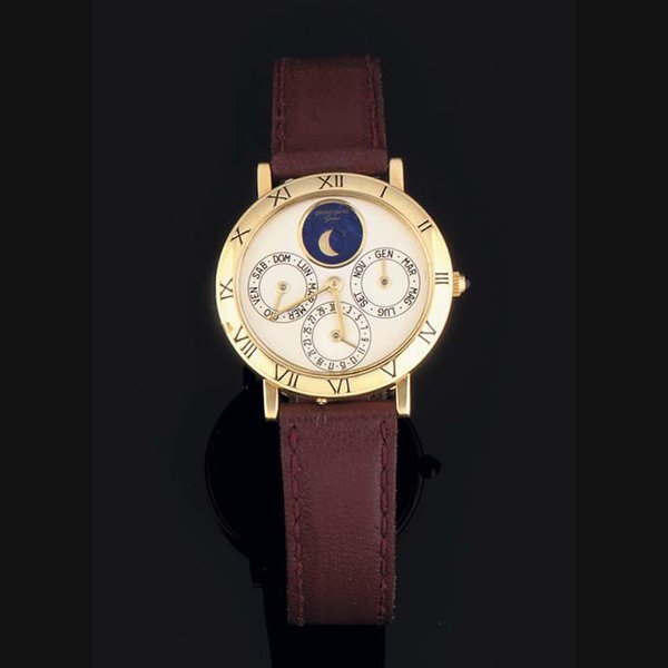 Gerald Genta Gerald Genta. An 18ct Gold Automatic Triple Calendar Oval Cased Wristwatch with Moonphase SIGNED GERALD GENTA, CASE NO G22304-21983, CIRCA 1990