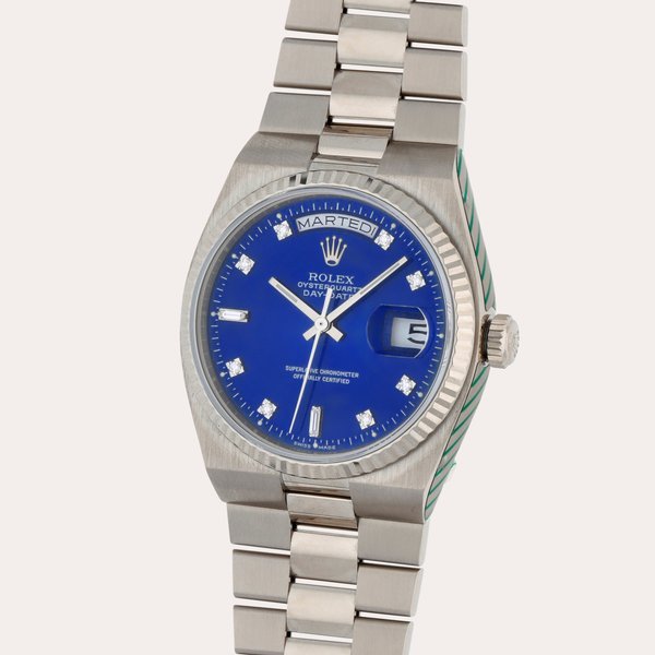 Rolex Oysterquartz Day-Date, Reference 19019N | A white gold and diamond-set wristwatch with day, date and bracelet | Circa 1987 · 19019N