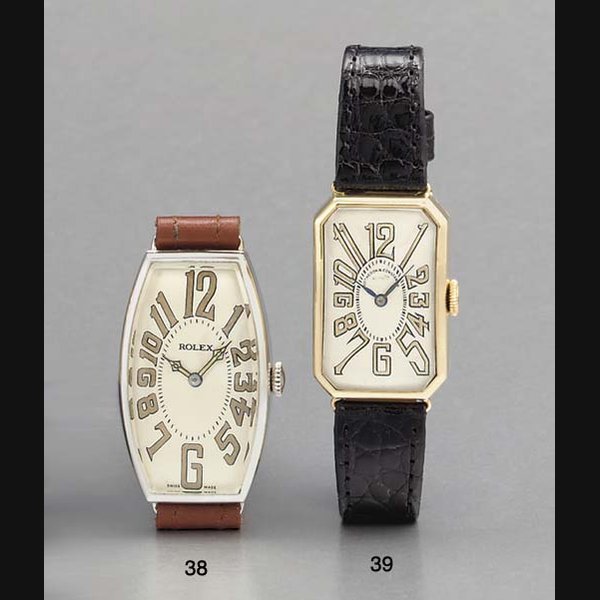 Rolex. A rare chrome curved tonneau-shaped hinged wristwatch SIGNED ROLEX, CIRCA 1925