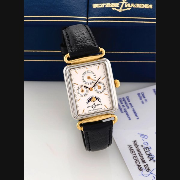 Ulysse Nardin ULYSSE NARDIN - MICHELANGELO BICOLOR Ulysse Nardin, "Michelangelo Calendar Moonphase", No. 0037, Ref. 334-44. Made circa 1990. Very fine, rectangular, water-resistant, stainless steel and yellow gold wristwatch with triple- date calendar and moon phases. Accompanied by an Ulysse Nardin box and certificate. | Important Modern & Vintage Timepieces | Geneve, 11 May 2014 · 334-44