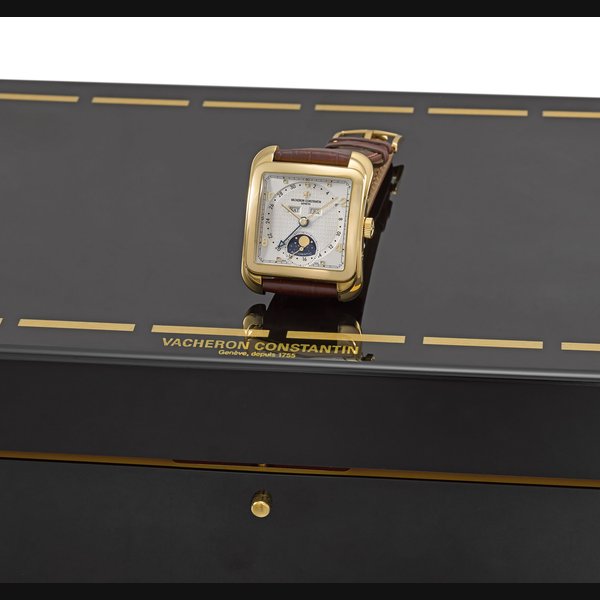 Vacheron Constantin. A large and attractive 18K gold cushion-shaped automatic triple calendar wristwatch with moon phases and box Signed Vacheron Constantin, Genève, Automatic, Toledo, “Historiques” Collection Toledo 1952 model, Ref. 47300/001J-9065, movement no. 948’232, case no. 784’151, manufactured in 2004