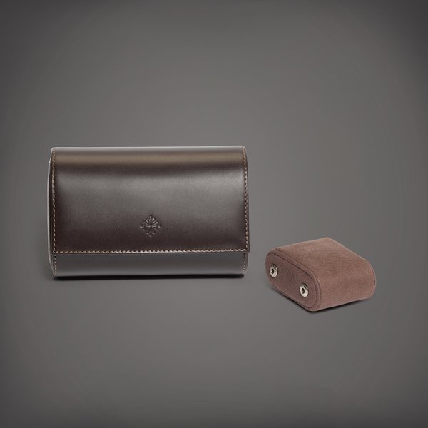 Patek Philippe A brown calf leather roll for two watches with removable cushions | Circa 2018