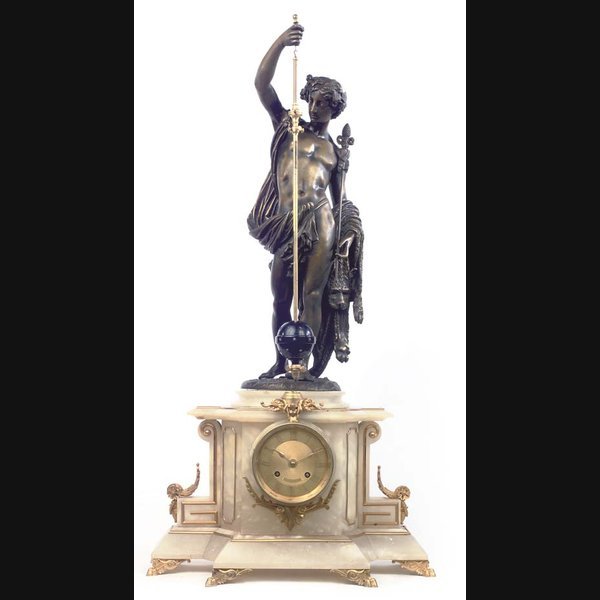 A French Onyx A French onyx, gilt and patinated metal striking conical pendulum clock