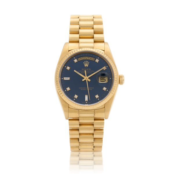 Rolex Day-Date, Ref. 18038  Yellow gold and diamond-set wristwatch with date, day and bracelet  Circa 1979 · 18038