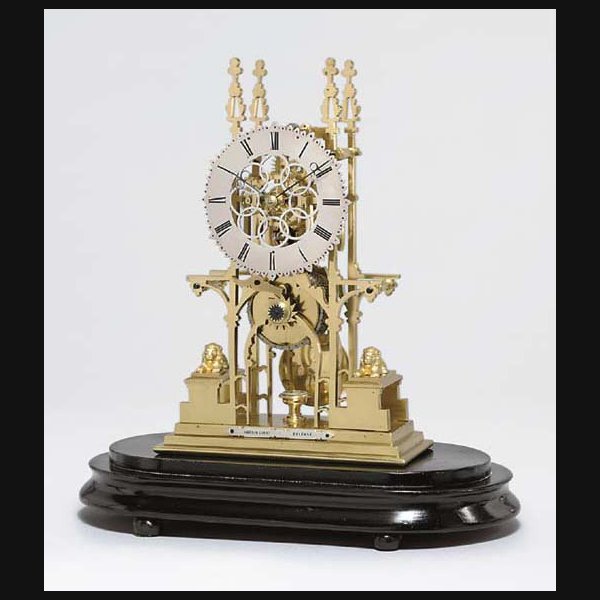 A Victorian brass skeleton timepiece SMITH'S OF CLERKENWELL, RETAILED BY HARBINSON & CO., BELFAST. CIRCA 1870