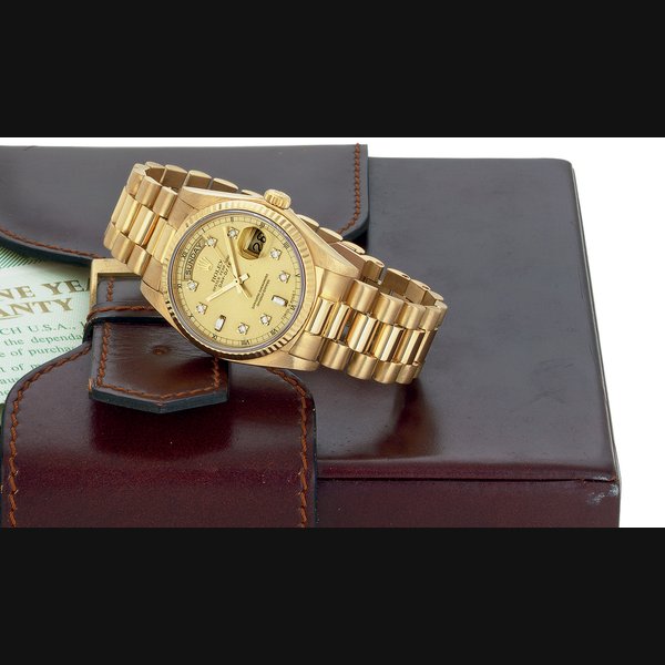 ROLEX. AN 18K GOLD AND DIAMOND AUTOMATIC WRISTWATCH WITH DAY, DATE AND BRACELET SIGNED ROLEX, OYSTER PERPETUAL, DAY-DATE, CASE NO. 7349729, REF. 18038, CIRCA 1983