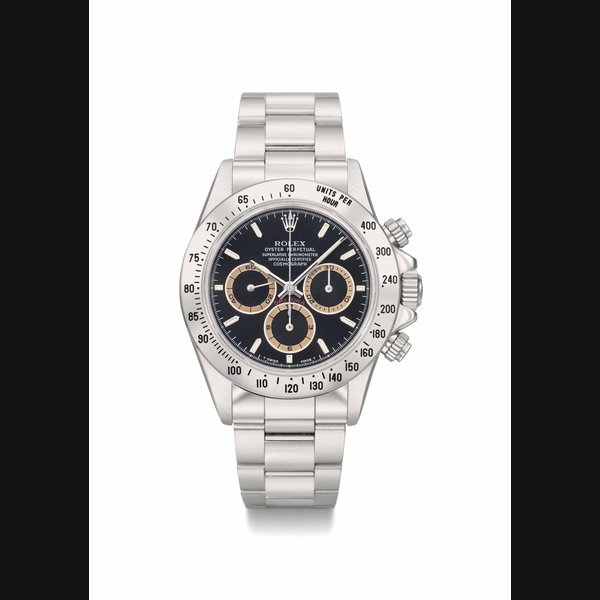 Rolex Rolex. A rare and attractive stainless steel automatic chronograph wristwatch with black dial, brown-coloured subsidiary dials, bracelet, original guarantee and box SIGNED ROLEX, OYSTER PERPETUAL, SUPERLATIVE CHRONOMETER, OFFICIALLY CERTIFIED, COSMOGRAPH DAYTONA, REF. 16520, CASE NO. W942065, MANUFACTURED IN 1996