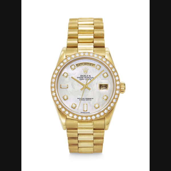 ROLEX. AN ELEGANT AND ATTRATIVE 18K GOLD AND DIAMOND-SET AUTOMATIC WRISTWATCH WITH, DAY, DATE, BRACELET, AND MOTHER OF PEARL DIAMOND DIAL DAY-DATE MODEL, REF. 18038, CASE NO. 9’131’649, CIRCA 1986