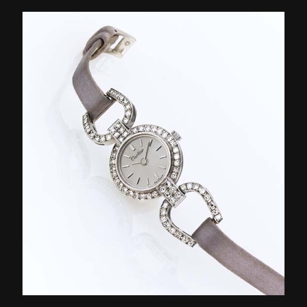 CHOPARD. A FINE LADY'S 18K WHITE GOLD AND DIAMOND WRISTWATCH SIGNED CHOPARD, NO. 85330, RETAILED BY CARTIER, CIRCA 1985