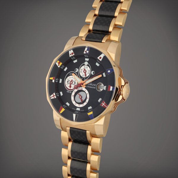 Corum Admiral's Cup Tides 44 Regatta, Reference 977.631.55 | A pink gold and carbon fibre wristwatch with, date, moon phases, tide indications and bracelet | Circa 2006