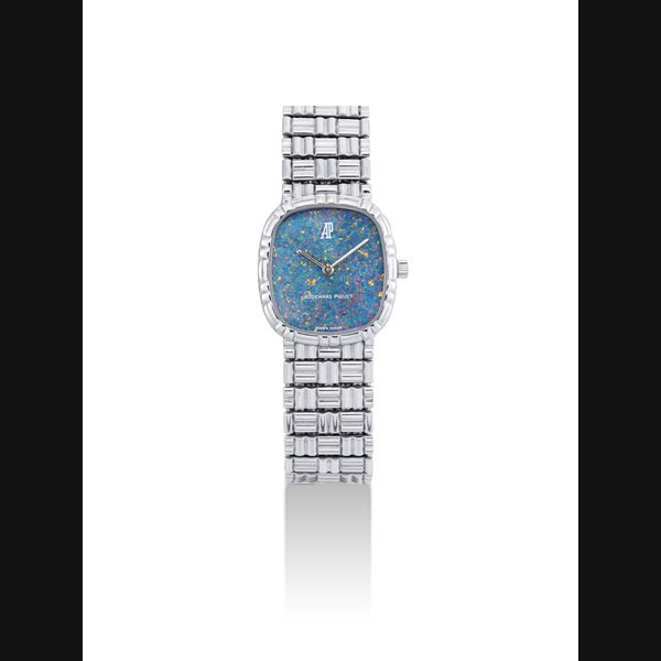 Audemars Piguet AUDEMARS PIGUET. AN 18K WHITE GOLD CUSHION-SHAPED BRACELET WATCH WITH OPAL DIAL SIGNED AUDEMARS PIGUET, CASE NO. D12004, CIRCA 1990