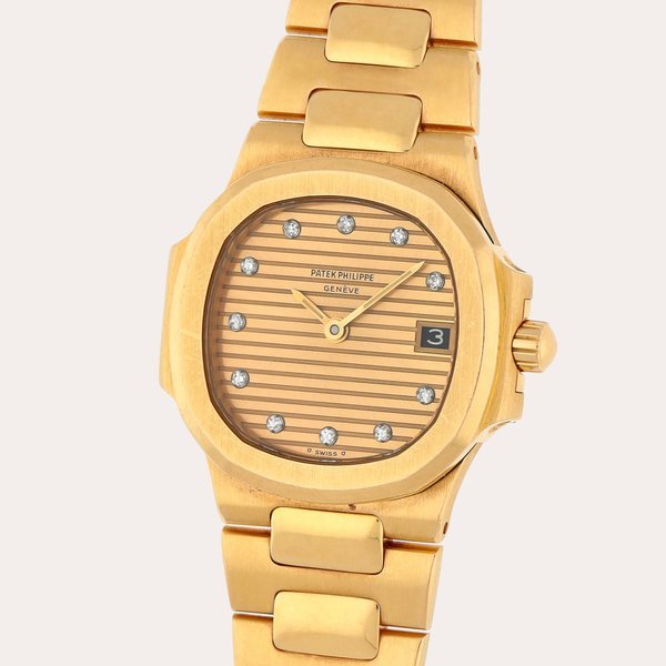 Patek Philippe Nautilus, Reference 4700/1J | A yellow gold and diamond-set wristwatch with date and bracelet | Circa 1987 · 4700/1J