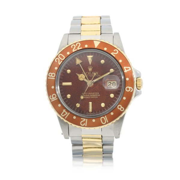 Rolex Rolex | GMT-Master 'Root Beer', Reference 16753, A yellow gold and stainless steel dual time zone wristwatch with tropical dial, date and bracelet, Circa 1980 | 勞力士 | GMT-Master 'Root Beer' 型號16753    黃金及精鋼兩地時間鏈帶腕錶，備日期及棕式錶盤，約1980年製 · 16753