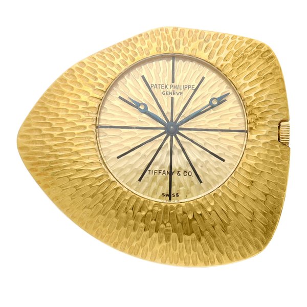 Patek Philippe Reference 7883, Retailed by Tiffany & Co.: A yellow gold asymmetrical open faced watch, designed by Gilbert Albert, Circa 1965 · 7883