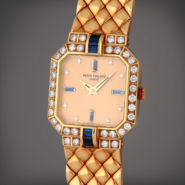 Patek Philippe Reference 4810/2 | A yellow gold sapphire and diamond-set wristwatch with bracelet  | Circa 1989