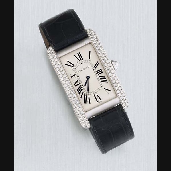 Cartier Cartier. An 18ct White Gold and Diamond Curved Rectangular Wristwatch SIGNED CARTIER, MODEL TANK AMERICAN, CASE NO 17361-C86029, CIRCA 2000