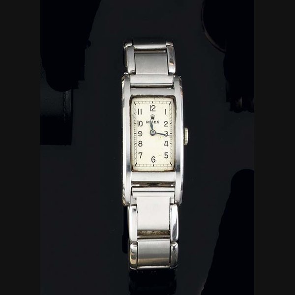 Rolex Rolex. A Stainless Steel Rectangular Curved Back Wristwatch on Bracelet SIGNED ROLEX, CASE NO 035048, REF 3060, CIRCA 1940