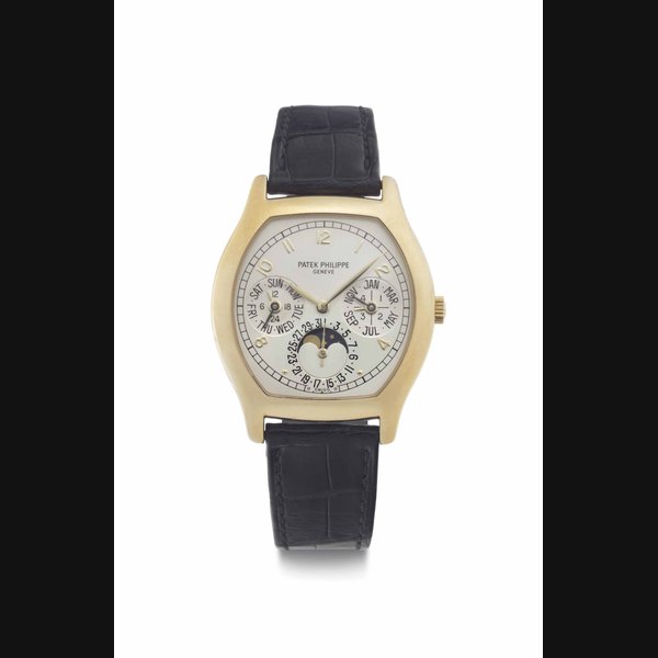 Patek Philippe. A Fine 18k Gold Automatic Tonneau-Shaped Perpetual Calendar Wristwatch with Moon Phases, Original Certificated, and Additional Solid Back SIGNED PATEK PHILIPPE, GENÈVE, REF. 5040, MOVEMENT NO. 3'124'328, CASE NO. 2'970'129, MANUFACTURED IN 2000