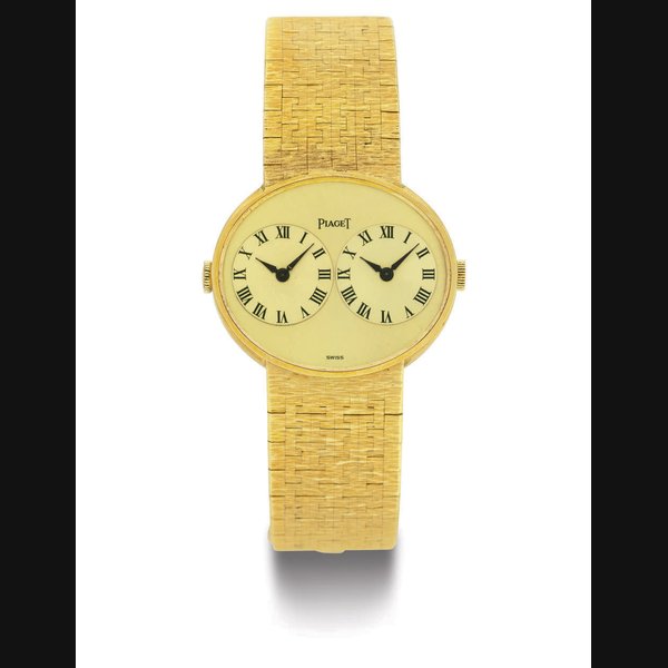 PIAGET. AN 18K GOLD DUAL TIME WRISTWATCH WITH BRACELET SIGNED PIAGET, CASE NOS. 612501 A6 AND 194459, CIRCA 1970