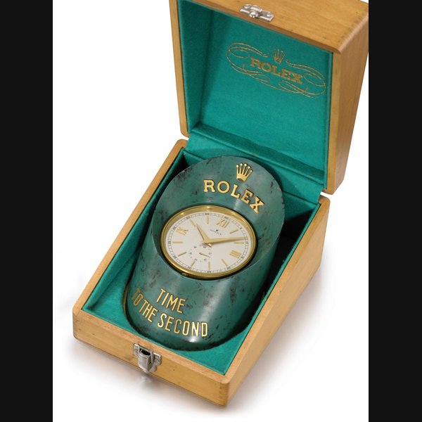 Rolex. A gilt brass and painted hoof-shaped display desk clock with stop feature and original box SIGNED ROLEX, TIME TO THE SECOND, MOVEMENT NO. 1362, CIRCA 1960