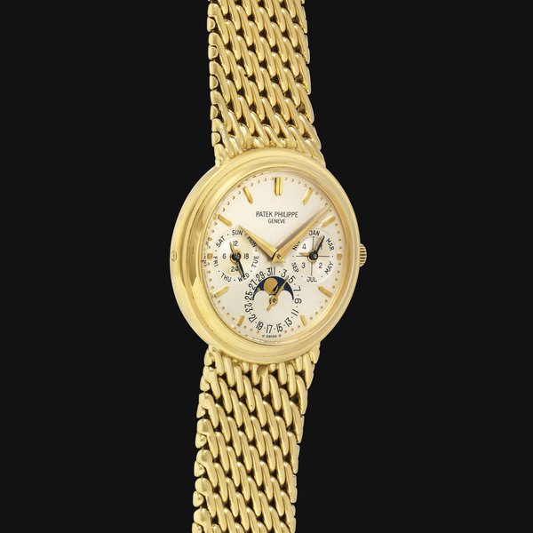Patek Philippe. A Fine 18k Gold Automatic Perpetual Calendar Wristwatch with Moon Phases, Additional Hard Back and Bracelet SIGNED PATEK PHILIPPE, GENEVE, REF. 3945/1, MOVEMENT NO. 771'179, CASE NO. 2'841'454, MANUFACTURED IN 1988
