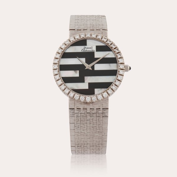 Piaget | A white gold and diamond-set bracelet watch with mother-of-pearl and onyx dial | Circa 1990