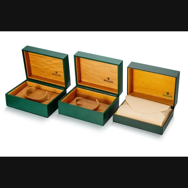 Rolex A set of three leather and wooden presentation boxes, Circa 1995 | 勞力士 | 一套三件皮製及木製盒子，約1995年製