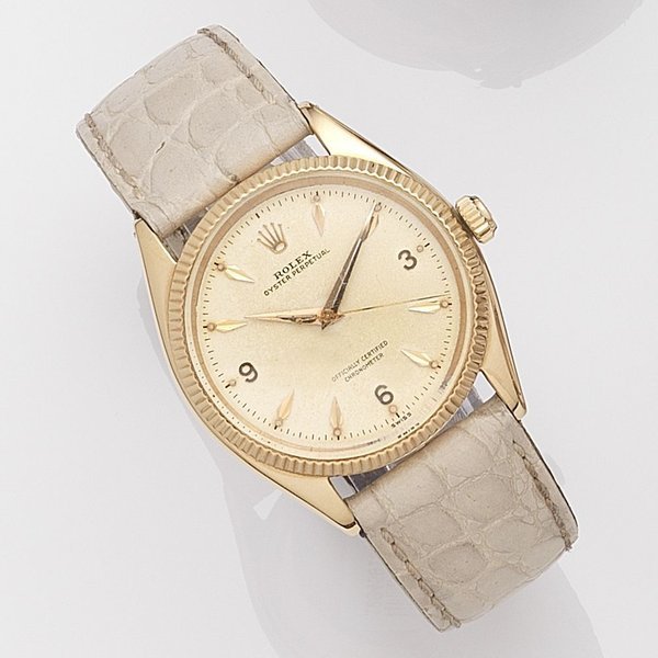 Rolex Rolex. An 18k rose gold automatic wristwatch Oyster Perpetual, Ref:6567, Serial No.118***, Movement No.579***, Circa 1955 · 6567