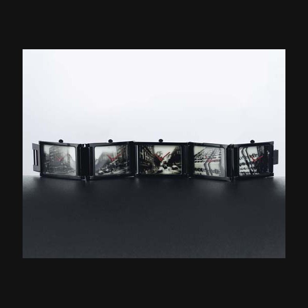 MOVADO. A LIMITED EDITION BLACKENED STAINLESS STEEL RECTANGULAR BRACELET WATCH WITH FIVE TIME ZONES SIGNED MOVADO, "TIMES/5", ANDY WARHOL, NO. 188/250, MANUFACTURED IN 1988