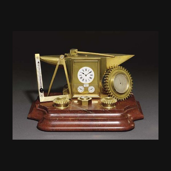 Anvil A French brass and red marble striking and repeating eight day inkwell compendium clock with calendar, barometer, thermometer and compass MARGAINE, PARIS. CIRCA 1880