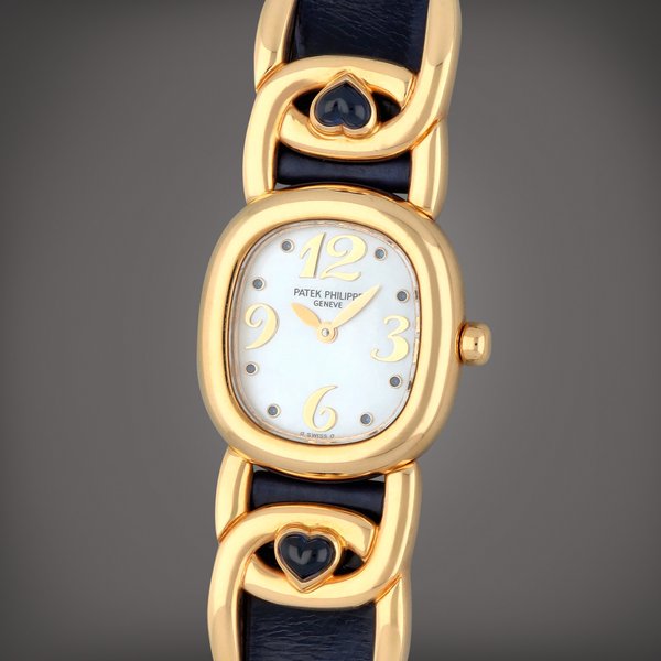 Patek Philippe Golden Ellipse, Reference 4833 | A yellow gold and sapphire-set wristwatch with mother-of-pearl dial | Circa 1995