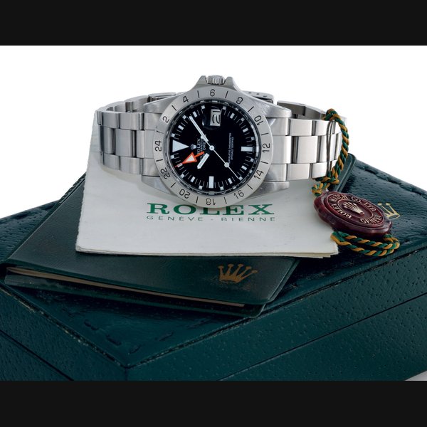 ROLEX. A STAINLESS STEEL AUTOMATIC WRISTWATCH WITH CENTER SECONDS, 24 HOURS, DATE, BRACELET AND ORIGINAL CERTIFICATE WITH BOX SIGNED ROLEX, OYSTER PERPETUAL DATE, EXPLORER II, STEVE MCQUEEN MODEL, MOVEMENT NO. D613912, CASE NO. 8270540, REF. 1655, CIRCA 1984