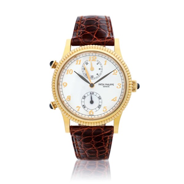 Patek Philippe Reference 4864 A yellow gold dual time wristwatch with 24-hour indication, Circa 2000