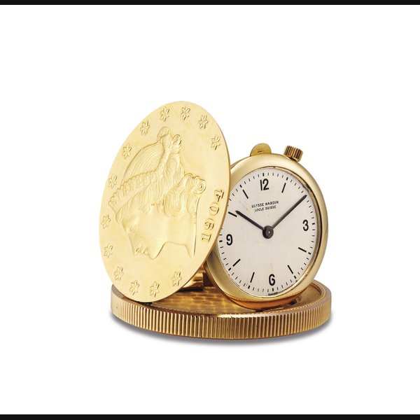 ULYSSE NARDIN. AN 18K GOLD TWENTY DOLLAR COIN WATCH SIGNED ULYSSE NARDIN, CASE NO. 682'905, CIRCA 1990
