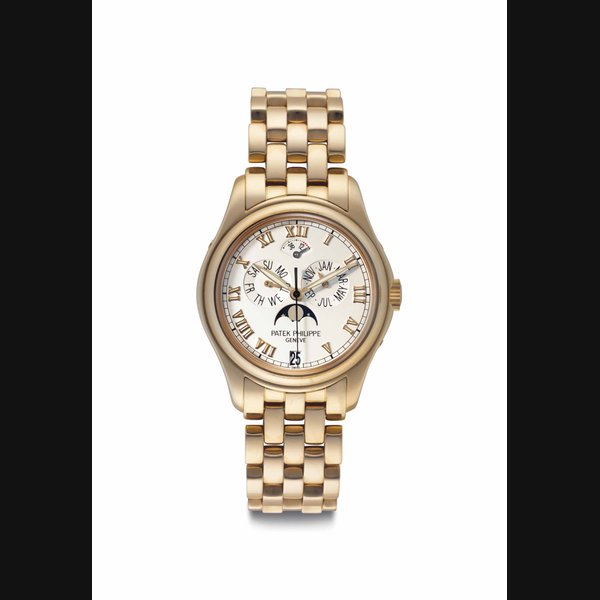 Patek Philippe. A Fine, Rare and Attractive 18k Pink Gold Automatic Annual Calendar Wristwatch with Power Reserve, Moon Phases, Center Seconds and Bracelet Signed Patek Philippe, Genève, Ref. 5036/1R, Movement No. 3’145’720, Case No. 4’146’429, Manufactured in 2001