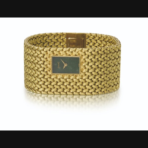 PIAGET. AN EXTREMLY RARE AND HIGHLY ATTRACTIVE 18K GOLD BRACELET WATCH WITH JADE DIAL SIGNED PIAGET, REF. 3879 D 1, CASE NO. 194'241, MANUFACTURED IN 1971