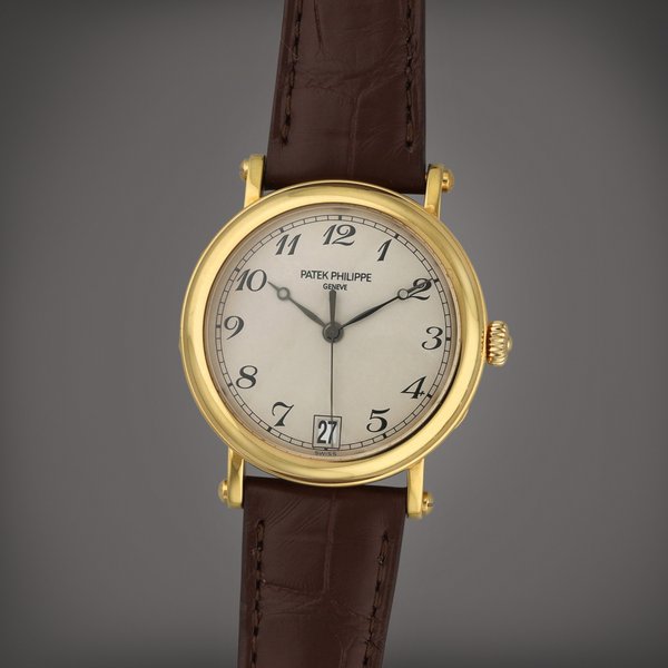 Patek Philippe Reference 5053J-001 | A yellow gold wristwatch with date | Circa 2006
