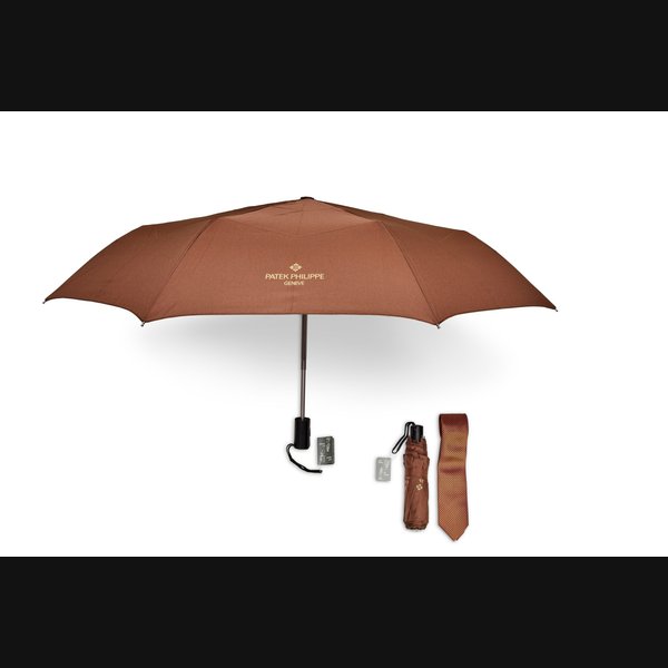 Patek Philippe A set of two folding umbrellas and silk tie, Circa 2015 and 2020 | 百達翡麗 | 一套兩把雨傘及領帶，約2015及2020年製